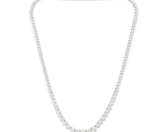 1110
A Graduated Diamond Line Necklace
18k white gold
Set with one hundred twenty-one graduated full-cut round diamonds, totaling 19.96cts and graded G-I color and I1 clarity
16.5" L
21.7 grams
Estimate: $8,000 - $12,000