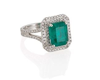 1111
An Emerald And Diamond Ring
Platinum
Centering a rectangular-cut emerald, weighing approximately 4.8cts, and surrounded by one hundred twenty-eight full-cut round diamonds, totaling 1ct and graded G-H color and SI clarity
Ring size: 7.5
9 grams
Estimate: $5,000 - $7,000