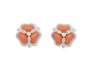 1126
A Pair Of Coral And Diamond Floral Ear Clips
18k white gold
Topped with six fancy shaped cabochon coral further set with one hundred three single and full-cut round diamonds, totaling approximately .7ct and graded F-G color and SI clarity
1" W
18.6 grams
2 pieces
Estimate: $2,000 - $3,000