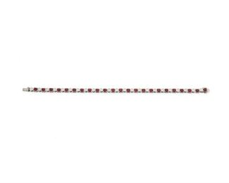 1128
A Ruby And Diamond Line Bracelet
18k white gold
Designed with twenty-three rectangular-cut rubies, totaling approximately 4.45cts, alternating with twenty-two full-cut round diamonds, totaling approximately 1.65cts and graded F-G color and VS clarity
7" L
15 grams
Estimate: $1,500 - $2,000