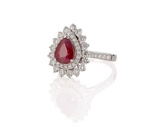 1131
A Ruby And Diamond Ring
Platinum
Centering a pear-shaped ruby, gauged at 1.7cts, and surrounded by forty-nine full-cut round diamonds, totaling approximately 1.35cts and graded H-I color and SI clarity
Ring size: 7.5
6.9 grams
Estimate: $2,500 - $3,500