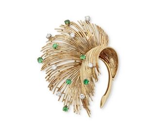 1139
A Tiffany & Co. Emerald And Diamond Feather Brooch
Circa 1955, tests 18k yellow gold, stamped: Tiffany & Co.
Set with seven full-cut round diamonds, totaling approximately .85ct, and seven round emerald, totaling approximately .6ct
2.5" L x 2" W
24.8 grams
Estimate: $3,000 - $5,000