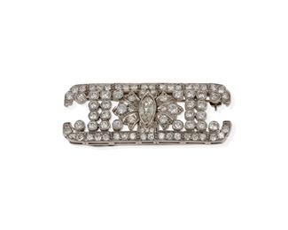 2005
A Modified Art Deco Diamond Brooch
Platinum
Centering a marquise-cut diamond, gauged at approximately .75ct, and further set with sixty-eight single and full-cut round diamonds, totaling approximately 3.5cts and graded G-I color and SI clarity
.75" H x 2" W
14 grams
Estimate: $1,800 - $2,500