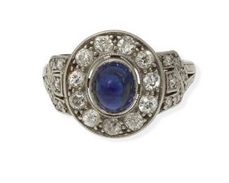 2004
An Art Deco Sapphire And Diamond Ring
Circa 1925, platinum
Centering a high cabochon sapphire, gauged at approximately 1.1cts, and surrounded by twenty-three single and full-cut small round diamonds, totaling approximately .4ct
Ring size: 4.5
4.5 grams
Estimate: $800 - $1,200