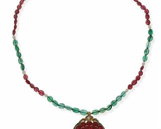2020
An Indian Gem-Set And Enamel Necklace
Suspending a pendant testing 18k yellow gold embellished by red cabochon glass and centering a tablet-cut diamond, the reserve adorned with green and red enameled flower motif, attached to a ruby and emerald bead necklace with seed pearls, with metal clasp
17" L x 1.5" H
25.8 grams
Estimate: $1,000 - $1,500