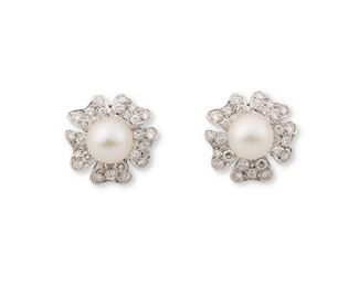2025
A Pair Of Cultured Pearl And Diamond Flower Ear Clips
Platinum
Set with two cultured pearls, measuring 10 mm, surrounded by fifty-eight full-cut round diamonds, totaling approximately 2.5cts and graded F-G color and VS clarity, with clip backs
.75" W
12.5 grams
2 pieces
Estimate: $800 - $1,200