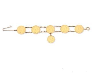 2029
A Gold Coin Bracelet
Set with five German 20 mark gold coins and suspending one German 10 mark gold coin, with 14k yellow gold link connectors
7" L x 2" W
50 grams
Estimate: $2,000 - $3,000