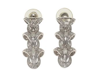 2064
A Pair Of Modified Diamond Earrings
14k white gold
Set with six baguette and sixty-six single and full-cut round diamonds, totaling approximately 2cts and graded G-H color and VS clarity
1.25" L
16.4 grams
2 pieces
Estimate: $1,000 - $1,500