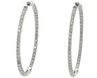 2075
A Pair Of Diamond Hoop Earrings
14k white gold
Entirely set with round diamonds, totaling 3.02cts and graded F-G color and SI clarity
1.75" D
9.9 grams
2 pieces
Estimate: $2,000 - $3,000