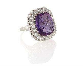 2082
An Amethyst And Diamond Ring
14k white gold
Centering a cushion-cut amethyst, gauged at approximately 8.8cts, surrounded by twenty single-cut round diamonds, totaling approximately .6ct and graded H-I color and VS clarity
Ring size: 6
8.4 grams
Estimate: $800 - $1,200
