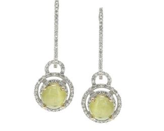 2096
A Pair Of Cats-Eye Chrysoberyl And Diamond Ear Pendants
14k white gold
Designed with a pair of micro pave diamond hoops with detachable drops set with two cat's eye chrysoberyls, totaling approximately 2.6cts, and further surrounded by small round diamonds
1" L
3.6 grams
4 pieces
Estimate: $1,000 - $1,500