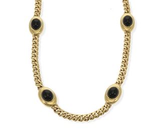 2114
An Italian Long Onyx Necklace
18k yellow gold, with Italian makers marks
Designed with four terminals set with oval cabochon onyx measuring approximately 14 mm x 12 mm, interspersed with a swage link chain
30" L
149 grams
Estimate: $4,500 - $5,500