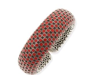 2128
A John Hardy Enamel Bracelet
Sterling silver and steel, stamped: [with mark for John Hardy] / Indonesia / 925
Designed as a domed flexible cuff topped with red enamel dots, with signed box
6" C x .85" W
111 grams
Estimate: $300 - $500