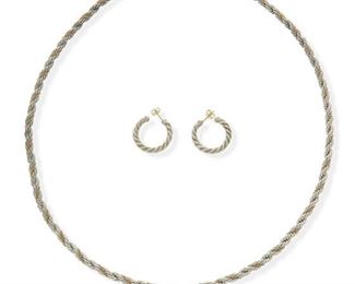 2133
An Assembled Set Of Jewelry, Comprising Tiffany & Co.
14k yellow gold and sterling silver
Comprising a Tiffany & Co. twisted rope necklace with tag, stamped: T & Co / Str-14k ( 24" L) and a pair of hoops earrings (1" C), with one signed blue suede pouch
62.9 grams gross
3 pieces
Estimate: $300 - $500