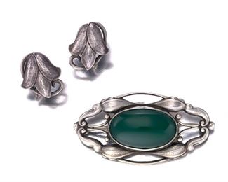 2135
A Group Of Georg Jensen Sterling Silver Jewelry Items
Third-quarter 20th Century; Brooch stamped for Georg Jensen; Each stamped: Sterling
Comprising a chrysoprase and silver brooch, No. 197 (1.128" H x 2.25" W), and a pair of screw-back earrings (.375" H x .75" W)
20.5 grams
3 pieces
Estimate: $200 - $400