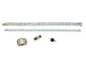 2148
A Group Of Jewelry
14k white and yellow gold
Comprising two aquamarine line bracelets (7" and 7.5" L), an aquamarine and simulated diamond enhancer (1" W), a garnet ring (ring sizes: 6.5) and a simulated yellow diamond and simulated sapphire ring (ring size: 7.5)
36.5 grams
5 pieces
Estimate: $500 - $700