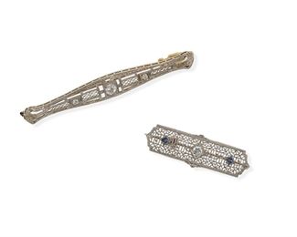 2149
Two Antique Diamond Bar Pins
Circa 1930, 14k white gold
Comprising a filigree pin set with three old European-cut diamonds totaling .3ct (2.75" L) and an openwork pin set with one round diamond and two square sapphires (1.5" L)
8.2 grams
2 pieces
Estimate: $400 - $600