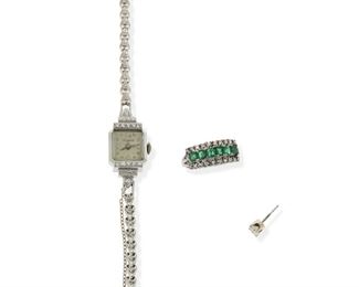 2151
A Group Of Jewelry Items
14k white gold
Comprising an emerald and diamond ring, a Kingston manual wristwatch set with small round diamonds, and a single diamond stud earring gauged at .25ct
Ring size: 7.75; Watch 5.5" L
24 grams gross
3 pieces
Estimate: $600 - $800