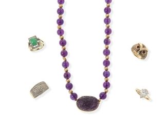 2178
A Group Of Jewelry
14k yellow gold
Comprising a necklace of graduated amethyst beads measuring 9 mm - 13 mm, interspersed with gold-filled beads and a 14k yellow gold clasp set with a carved amethyst measuring 30 mm x 17 mm (32" L); a jadeite and diamond ring (ring size: 7); an owl ring with round ruby eyes (ring size: 7); a Greek key patterned ring set with small round diamonds (ring size: 7); and a simulated pear-shaped diamond ring
Four rings: 28 grams gross
5 pieces
Estimate: $600 - $800