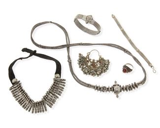 2189
A Group Of Indian Jewelry
Silver and silver-toned metal
Comprising two necklaces, two bracelets, an amber ring, and a single nose ring
Longest necklace: 28" L
263 grams gross
Estimate: $200 - $400