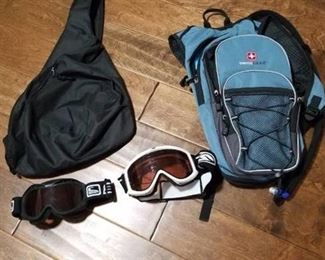 Swiss Gear camel bag, sling backpack and 2 goggles