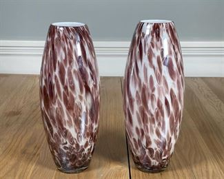 PAIR ART GLASS VASES | A pair of vases with a milk glass interior and an iridescent spotted purple design throughout; h. 11 x dia. 5 in. 