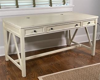 WHITE PAINTED COMPUTER DESK | Very well built, having three drawers, one with dropdown front (option to be used as a keyboard tray) trestle frame with a stretcher, having metal cap inserts on the top for routing cables; h. 30 x w. 60 x d. 30 in. 