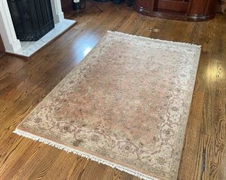PEACH COLOR RUG | Having an overall pattern on a peach field within a pale peach border; 9 ft. 6 in. x 5 ft. 10 in. 