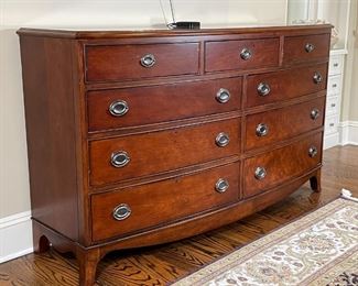 BOW FRONT DOUBLE DRESSER | Chest of drawers, having three drawers over two banks of three drawers, with nickel hardware, on bracket feet; h. 38-1/2 x w. 66 x d. 20 in. 