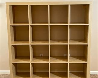 CUBE BOOKSHELF | 4 x 4 cubby bookshelf by Ikea, in a natural wood finish; h. 59 x w. 59 x d. 15-1/2 in. 