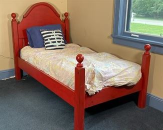 RED PAINTED SINGLE BED | Eddy West twin bed with a domed top headboard and four posts with ball finials; h. 53 x l. 83 x w. 44 in. 