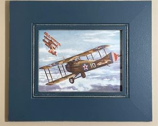 ALFRED SWLES DOG FIGHT PRINT | Print of a watercolor painting showing two airplanes, in a rustic blue painted frame; sight 11-1/2 x 15-1/2 in.; overall 22-1/2 x 26-1/2 in. (frame) 
