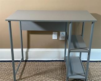 GRAY COMPUTER TABLE | Gray laminate desk with open shelves, of nice small size and appearing in overall very good condition; h. 30 x w. 36 x d. 20 in. 