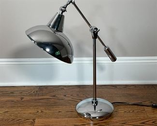 CHROME ADJUSTABLE LAMP | Adjustable counter weight table lamp, articulating arm with a weighted base; h. 24 x w. 20 x d. 10 in. 
