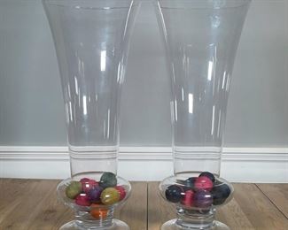 PAIR LARGE GLASS VASES | Monumental and tall! Decorative glass vases each with colorful yarn balls; h. 27-1/2 x dia. 11-1/2 in. 