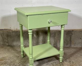 GREEN PAINTED STAND | Having a singled drawer and a lower shelf; h. 25 x w. 20 x d. 15 in. 