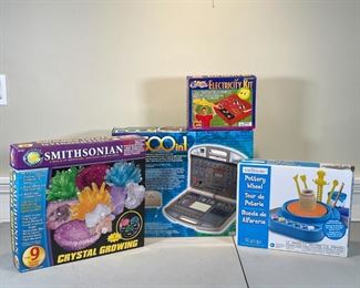 (4pc) CREATIVE LEARNING TOYS | Including a Maxitronix 500 in 1 Electronic Lab, a Slinky Science Electricity Kit, a Creatology Pottery Wheel, and a Smithsonian Crystal Growing kit [all untested, unsure if complete] 