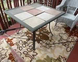 METAL PATIO TABLE W/TILES AND PATIO RUGS