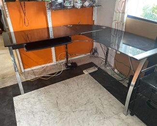 Glass top L shaped desk with chrome legs