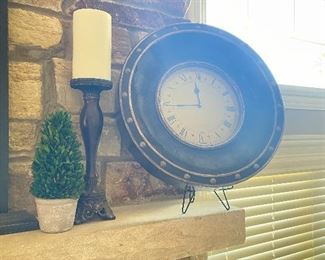 Faux plant, candlestick, wall clock