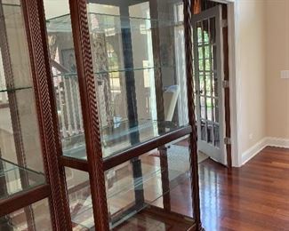 Howard Miller 1 of 2 lighted display cabinets w/glass shelves and sliding doors
