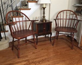 Two Windsor Oval Back Arm Chairs and a Lamp Table with Glass Door