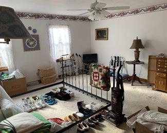 shoes, linens, new & older quilts....bed frame not for sale