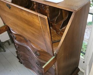 Desk showing cubbies and interior storage
