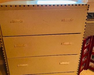 A pair of vintage vinyl covered chest of drawers