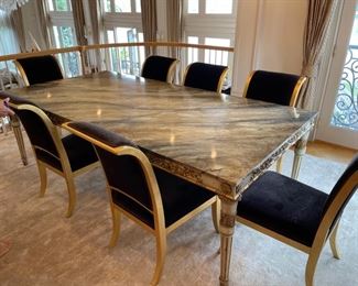 Dining room table  by John Richards fine furnisher 96 inches long and 48 inches deep with  brown marble top