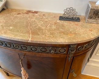 Half-moon large mahogany and Kingswood marquetry chest 2 draw with bronze mounts bowed front and purple and white marble cabinet from Gardener Antiques, 47x22, appraised at $2,400.