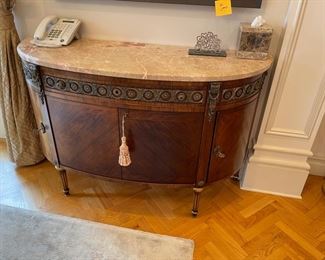 Half-moon large mahogany and Kingswood marquetry chest 2 draw with bronze mounts bowed front and purple and white marble cabinet  from Gardener Antiques, 47x22, appraised at $2,400.