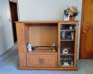 Oak Colored Entertainment Center with Assorted Collectables and Silk Flowers