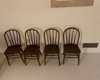 four small wooden chairs that were in a church 70 years ago